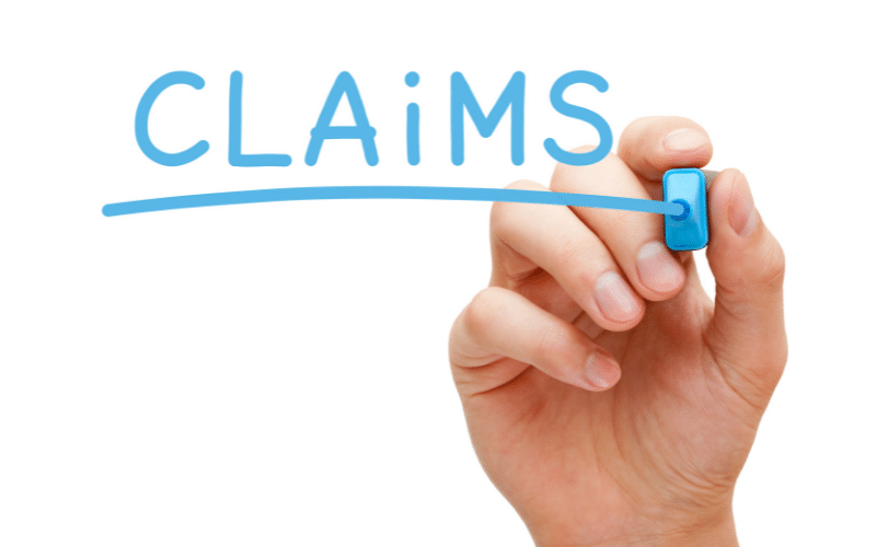claimsの青い文字とペンでそれを書く手